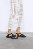 Leather sandals with binding