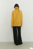 Knitted sweater with a voluminous neck