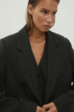 Double-breasted woolen jacket in a gray-green stripe