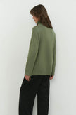 Knitted sweater with a voluminous neck