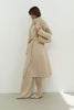 Trenchcoat with a free cut in cream/black