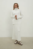 Knitted sweater with a voluminous neck