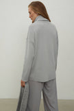 Knitted sweater with a voluminous neck