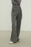 Woolen pants with a tie in black