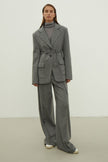 Single-breasted woolen jacket with a tie in gray