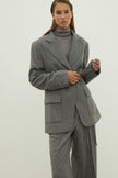 Single-breasted woolen jacket with a tie in gray
